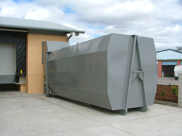 self contained auger compactor on location
